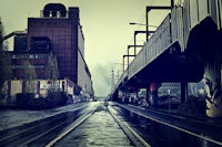 a train tracks on a rainy day