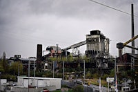 a building with a factory in the background