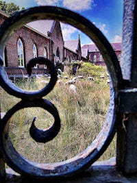 a view of a building through a fence