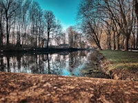 a concrete wall next to a waterway