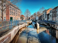 a bridge over a canal in a city