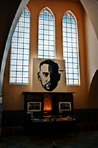 a stained glass window with a portrait of a man