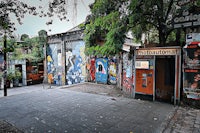 a brick building with graffiti on it