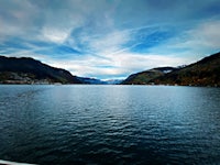 a view of a lake with mountains in the background