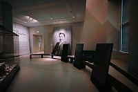 a room with a picture of a man on the wall