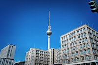 a building with a tv tower in the background
