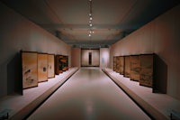 a museum with a lot of paintings on display