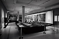 a black and white photo of a museum display