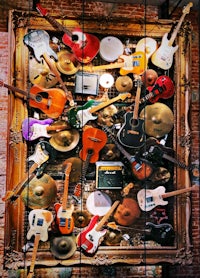 a framed display of guitars and other musical instruments