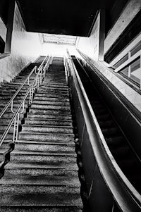 an escalator with metal railings