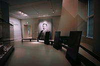 a room with a picture of a man on the wall