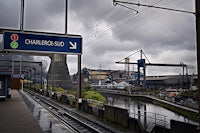 a train station with a sign