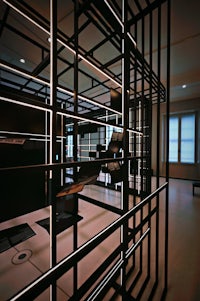 the interior of a room with a black cage