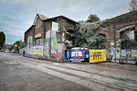 a brick building with graffiti on it