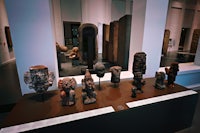 a display of various statues in a museum