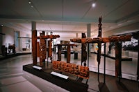 a museum with a lot of wooden artifacts on display