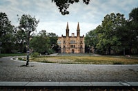 a large building in the middle of a park