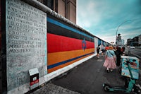 a mural on a wall in berlin, germany