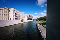 a canal with a building in the background